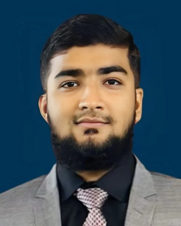 Muhammad Abdullah, Enterprise AI Engineer, in a grey suit against a navy background